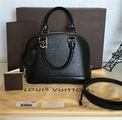 Alma bb leather handbag Louis Vuitton Black in Leather .